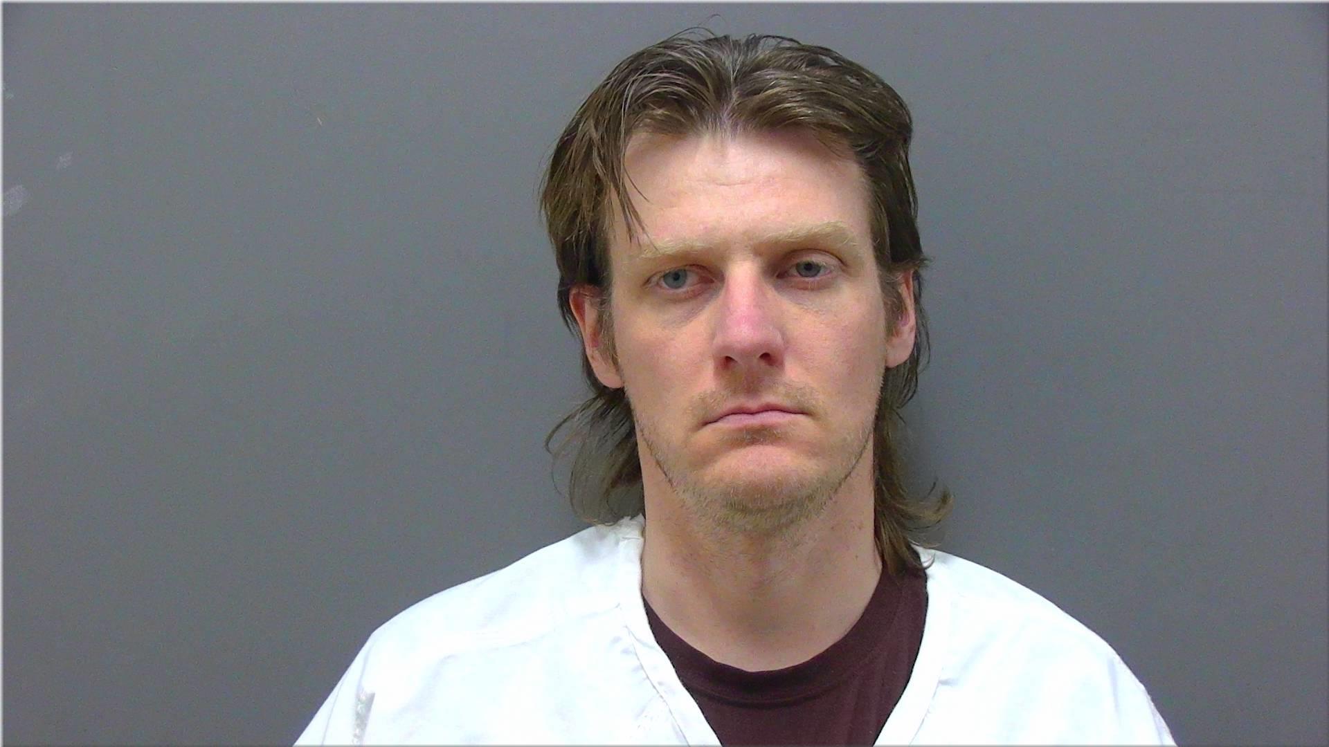 Mugshot of Della, Douglas J